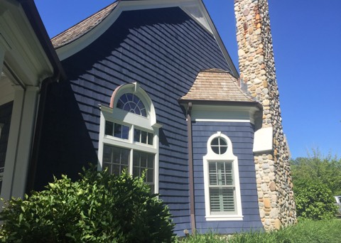 Exterior painting of blue exterior colonial home